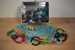 An assortment of costume necklaces, including a fluorite beaded necklaces along with other statement
