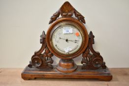 A 19th century mahogany mantel barometer, beautifully carved having acanthus leaf decoration,