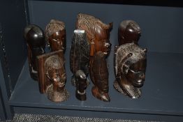 A group of African wooden busts, hand carved in ebony, to include tribal figures, bookends ect, (