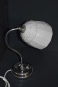 An mid- 20th century Art deco style chrome table lamp, having swan neck, adjustable glass shade