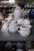 A Wiuterling ceramic tea service, decorated with daisies on a baby blue glaze ground, comprising