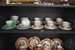 Two vintage part tea sets, to include Taylor & Kent bone China decorated in lime green colour and