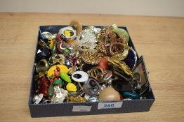 An assortment of costume jewellery, including clip-on earrings, paste set rings and statement