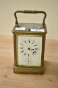 An early 20th century Aiguilles 8-day repeating carriage clock having Roman numerals, glass panels