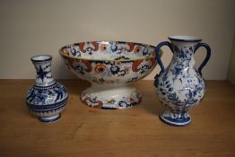 A large Victorian ironstone footed bowl decorated with blue and red scrolls and foliage on a white