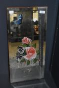 A late 19th / early 20th century bevelled edged rectangular mirror, the glass decorated with a