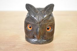 An early 20th century black forest style carved wooden owl inkwell, having glass eye's, h8cm