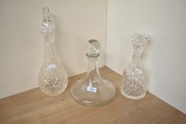 A late 20th Century clear glass ship's decanter and stopper, with etched inscription and measuring