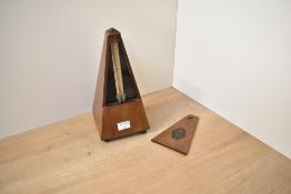 A vintage Maelzel Metronome, bearing the plaque Maelzel Paquet 1815 - 1846 Made in France, appears