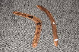 An Australian wooden boomerang, hand decorated with aborigenol figures and Aztec patterns, w50cm,