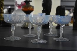 A group of 5 19th century hand blown vaseline opalescent champagne glasses having tight twist stem
