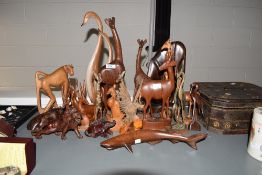 A group of carved wooden animals, to include a baboon, giraffe, shark, hippopotamus ect, ( 21 ).