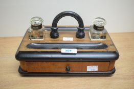A 19th century rosewood desk caddy fitted having glass inkwell and pen tray, w25cm