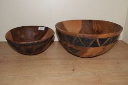 A large mango wood fruit bowl, decorated having Aztec patterns to the exterior, w29cm, sold together