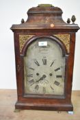 A 19th century mahogany bracket clock having Roman numeral and silvered dial, engraved 'W Woodyear