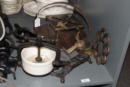 A large cast iron griddle, w30cm, sold together with a crown pencil sharpener, a king lemon squeezer