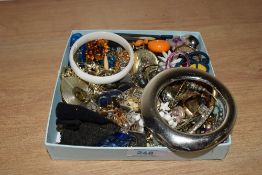 A collection of costume jewellery, including bangles, clip on earrings, hair accessories and rings