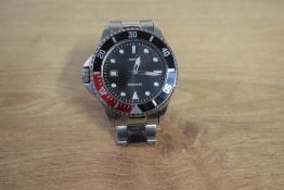 A Sekonda wristwatch, the circular black dial having geometric numerals and date aperture, on a