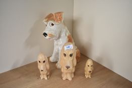 A large Sylvac Terrier Dog number 1380 measures 29cm tall sold together with three sad-faced beige