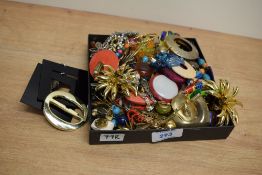 An assortment of clip-on earrings, including large statement earrings and paste set examples