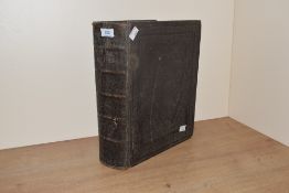 A large leather bound Holy Bible containing the Old and New Testaments, H32cm