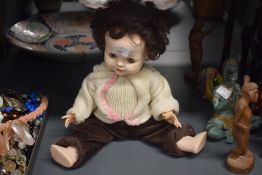 A vintage Pedigree plastic doll presented in a seated position , h24cm