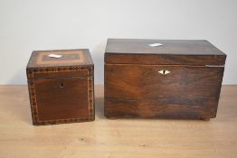 A 19th century rosewood tea caddy fitted with two lidded compartments and mother of pearl inlay,