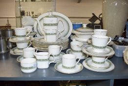 A Royal Doulton Fine Bone China Rondelay pattern tea service, having green banding and gilt edging