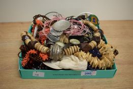 An assortment of costume jewellery, including wooden pieces, imitation coral, statement pieces and