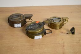 A set of three military brass compasses, dated for 1940, 1941 and 1944, engraved to the back '