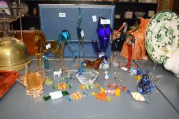 A group of Murano style glass figures, to include glass sweets and a Mat Jonasson paperweight, (