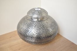 A contemporary hand beaten white metal Indian vase in globular form, factory sticker to base '