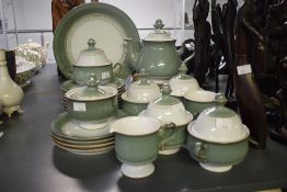 A Denby part dinner service, decorated having circular geometric patterns on a green and white glaze