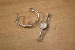 An Accurist wristwatch, the circular mother-of-pearl dial having Arabic and baton numerals, with a