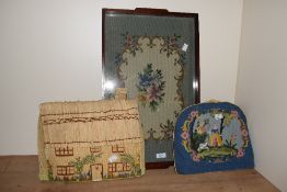 A vintage serving tray decorated having handmade floral needlepoint work encased within a mahogany