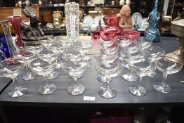A set of 23 Babycham glasses, having gilt colour rims with yellow baby logo, h10cm