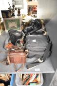 A selection of cameras and camera equipment, to include a Super Paxette, a Pentax, a Kodak Retina