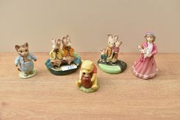 A group of five Royal Doulton bone china and Beswick pottery studies comprising 'Winnie The Pooh and