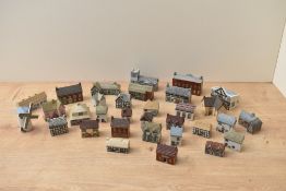 A Wade English porcelain 'Whimsey-On-Way' porcelain English village comprising complete sets one