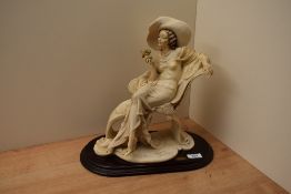 Capodimonte Giuseppe Armani Florence figurine 'At Ease', signature to the front, measuring 39cm