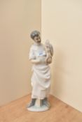 A large Lladro porcelain figure group number 4763, 'Obstetrician' Doctor with new born baby,