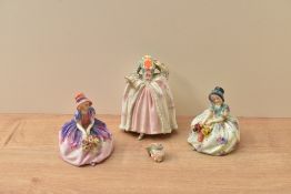 A group of three Royal Doulton bone china figurines comprising 'Monica' HN 14, 'Monica' HN `1458 and
