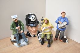 A group of three Royal Doulton bone china figures comprising 'The Boatman' HN 2417, 'A Good Catch'