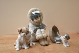 A group of three Lladro and Nao by Lladro figures comprising 'Artic Dreams' number 1397, 'Puppy