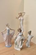 A group of three Lladro and Nao by Lladro porcelain figures comprising 'Dancer' number 5050, 'How