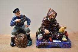 Two Royal Doulton bone china figures 'The Potter' HN 1493 and 'The Lobster Man' HN 2317.