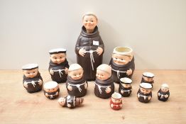A selection of Goebel porcelain monks comprising egg cup, mug, condiment pot etc.