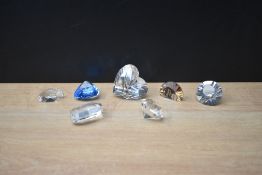 An assortment of Swarovski crystal decorations including hearts, all with boxes.