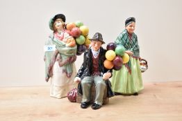 Three Royal Doulton bone china figures 'The Balloon Man' HN 1954, 'The Balloon Seller' HN 583 and '