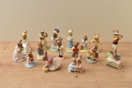 A collection of sixteen Royal Doulton bone china Bunnykins Series figures including characters '